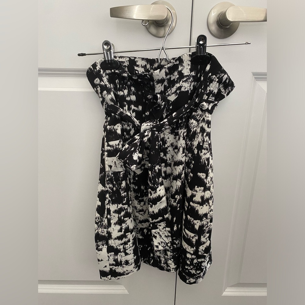 Pattern black and white skirt with front tie. Good condition with pockets